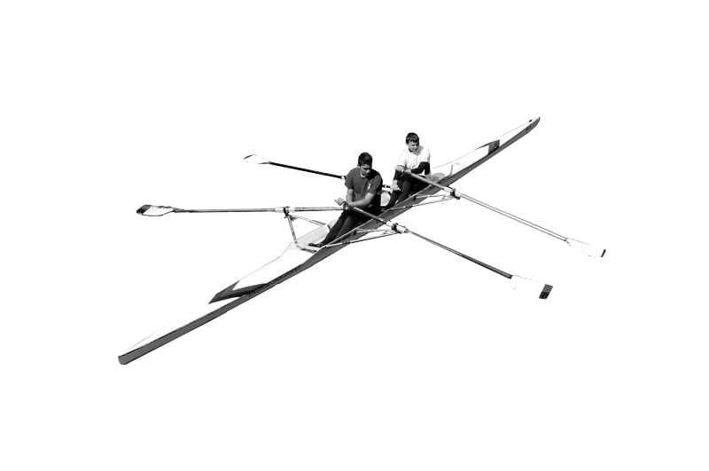 Two rowers holding oars in a long thin boat.
