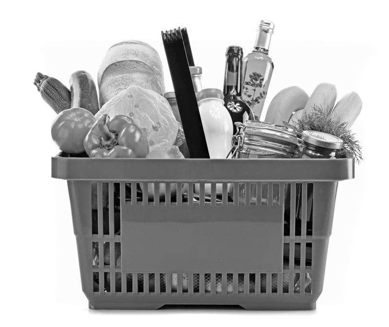 A plastic shopping basket full of groceries