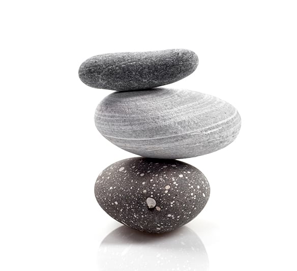 Three pebbles balanced on top of each other