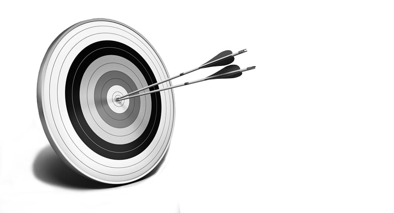 Two arrows in the bullseye of an archery target