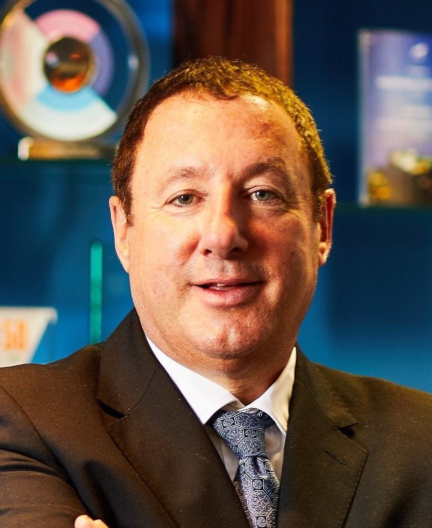 Martin Port wearing a suit and smiling
