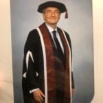 Philip Powell in a graduation gown