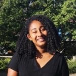 Simone Wyatt smiles standing in sunshine