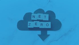 An image of a cloud with an arrow pointing down with scrabble pieces that read net zero