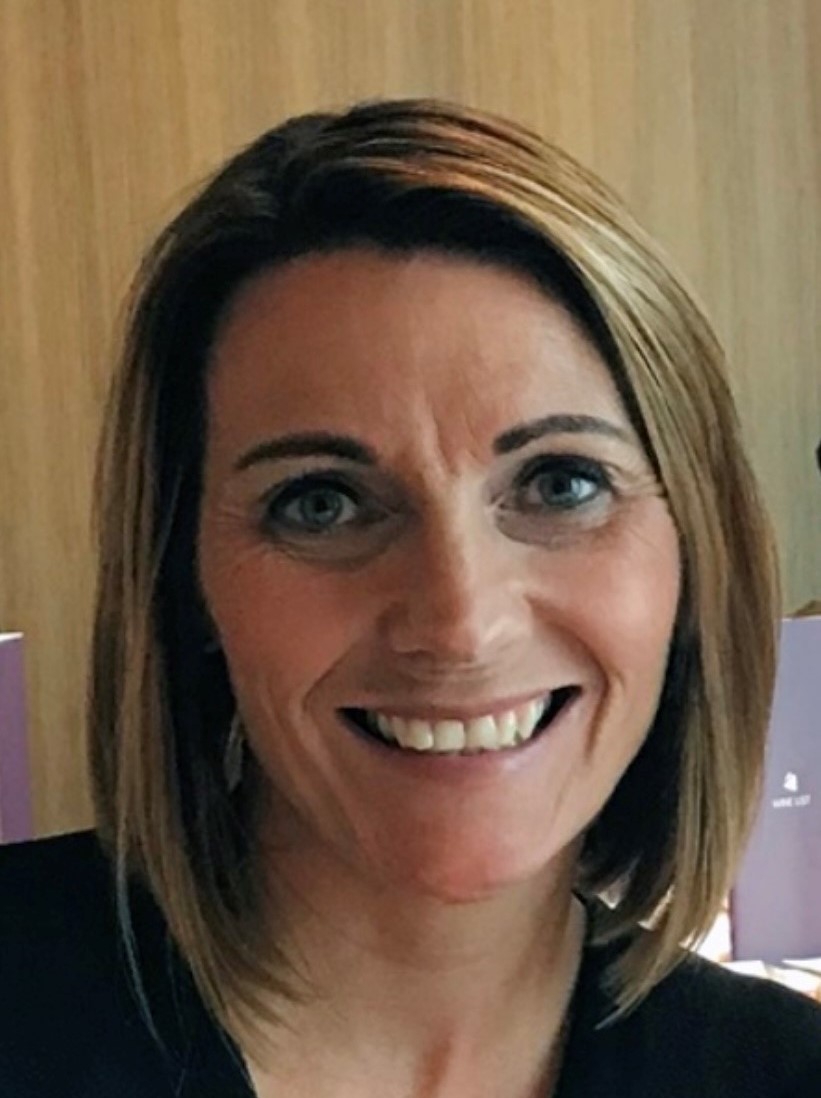 An image of Rachel McVeigh smiling at the camera.